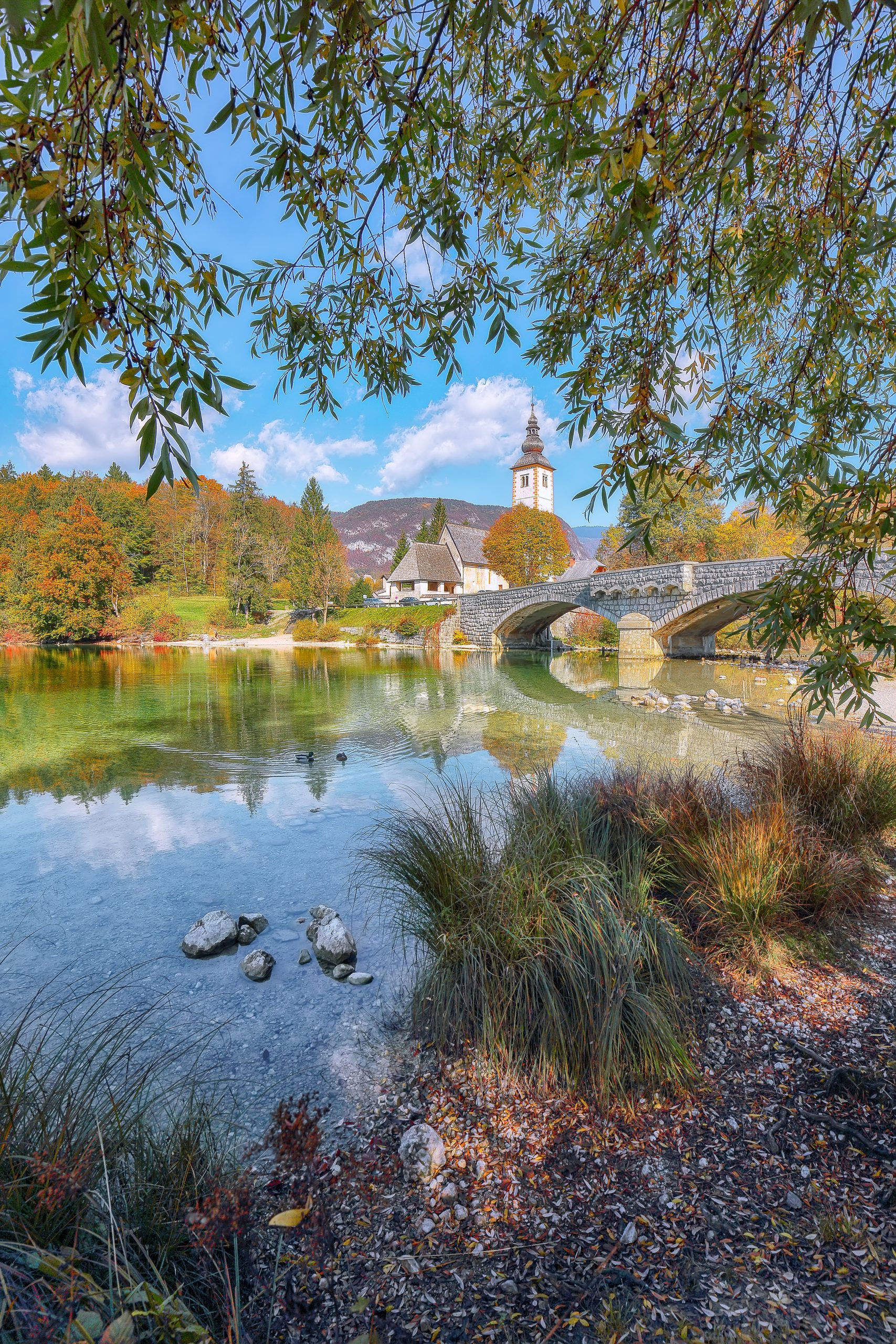 Gorgeous view  of  Church of St. John the Baptist on Bohinj Lake . Popular tourist destination Location: Municipality of Bohinj, Upper Carniola region, Triglav National Park, Slovenia, Europe